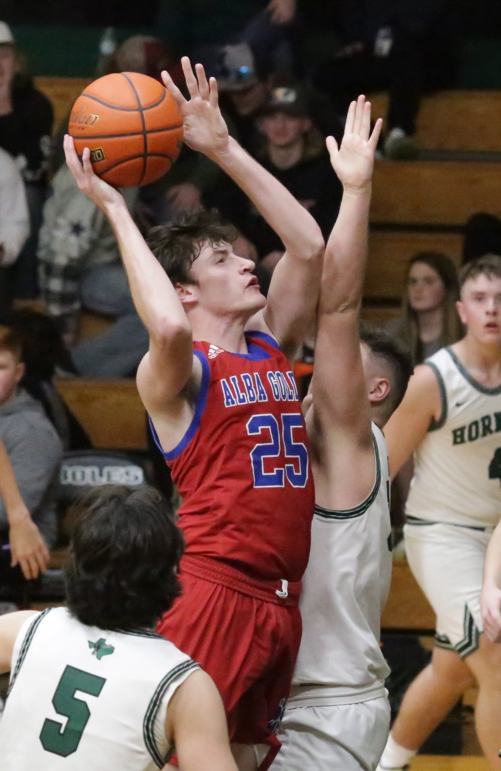 Alba-Golden’s Kaden Kennedy puts up a short jumper from the lane in action against Boles.